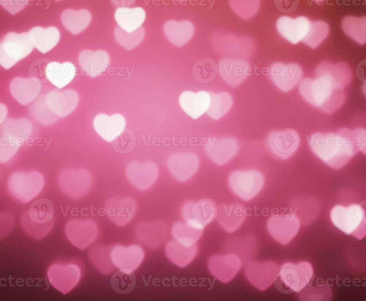 Pink blurred abstract background with cute bokeh hearts. photo