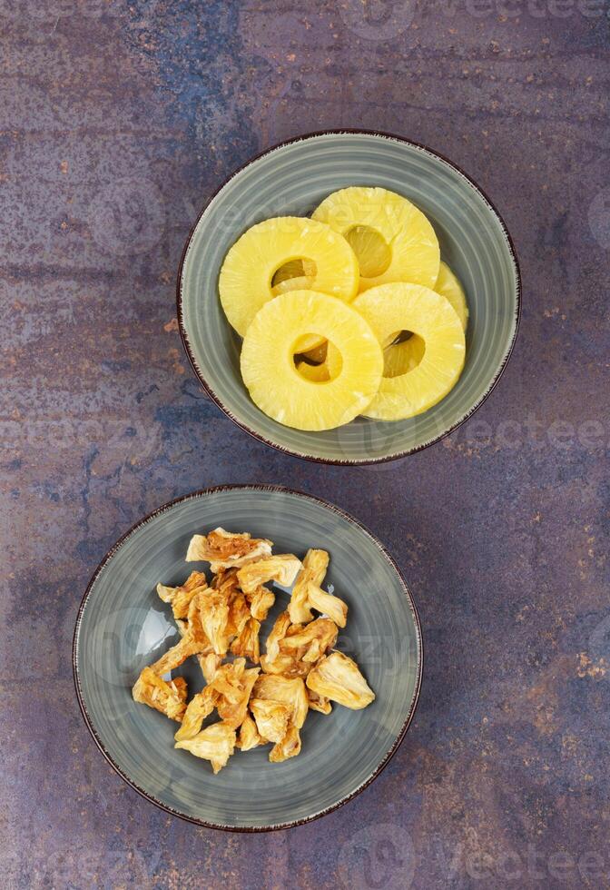 Natural dried pineapple in bowl photo