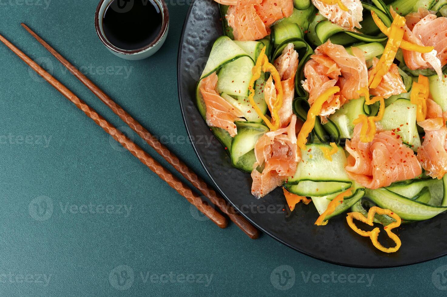 Salted salmon salad with green cucumber. photo