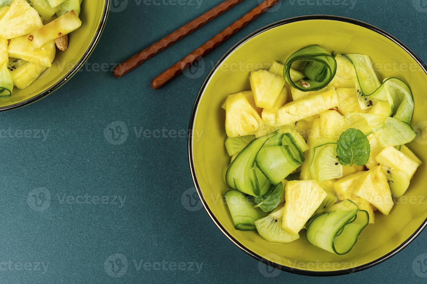 Fresh exotic vegan salad with pineapple. photo
