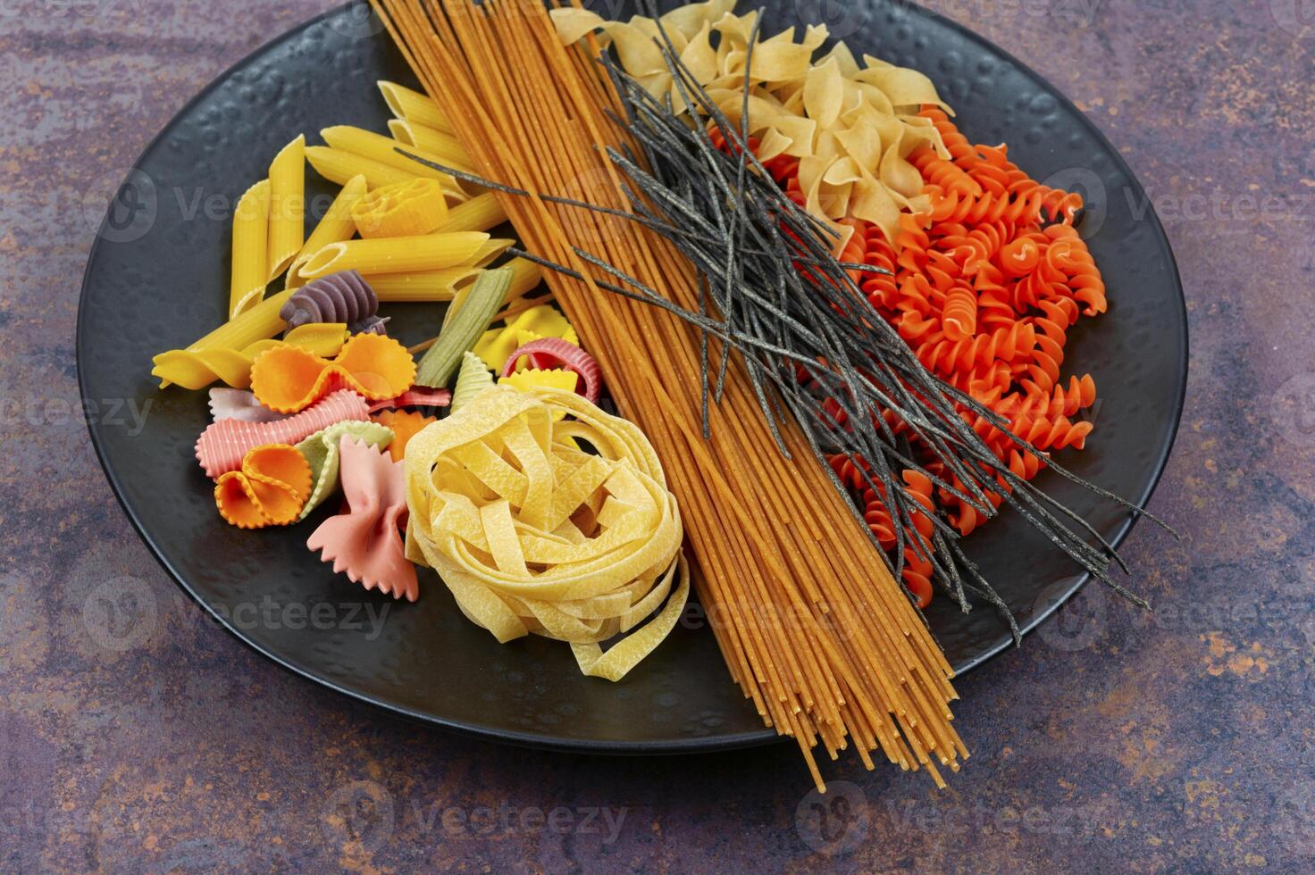 Assortment of raw pasta and macaroni. photo