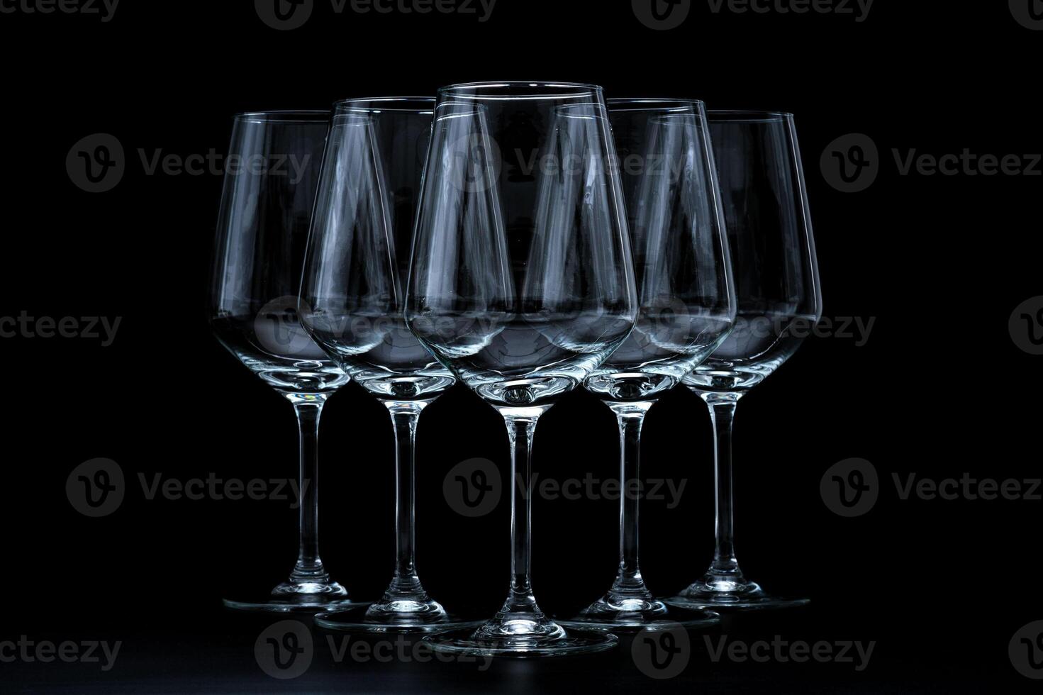 silhouette of wine glass bottle full of smoke in black background photo