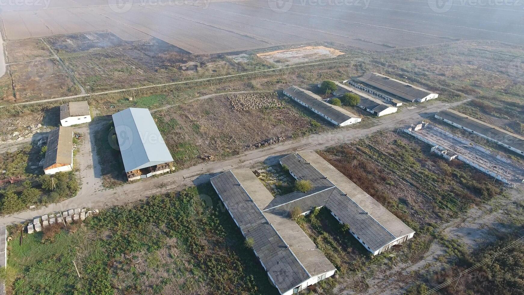 The building of an old farm for cattle. Top view of the farm. Storage of bales of hay on the old farm photo