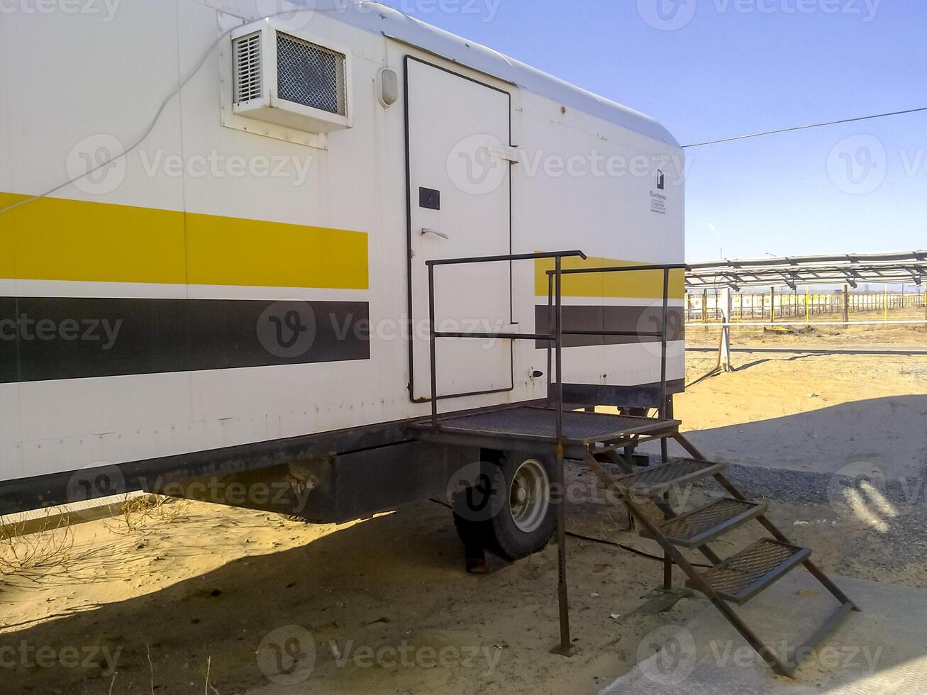 Residential trailers for shift workers in the oil field. The car-house. Residential infrastructure for oil workers for rest outside working hours. photo