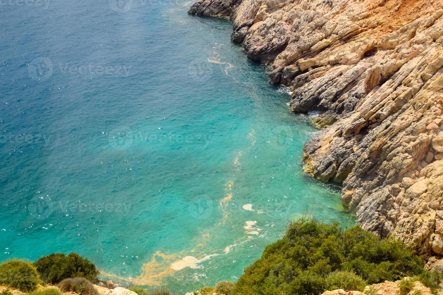 Coastal cliffs of limestone. The coast of Mediterranean Sea in Turkey. photo