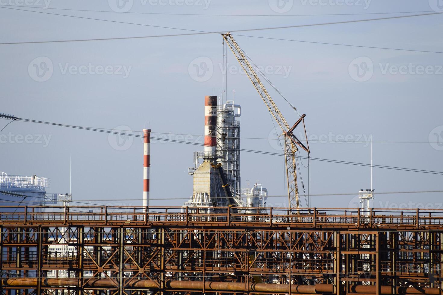 Distillation columns, pipes and other equipment furnaces refinery. photo