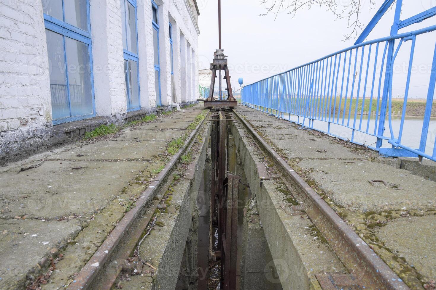 Slot lock water pumping station. Lock bolts. Hydraulic construction. photo