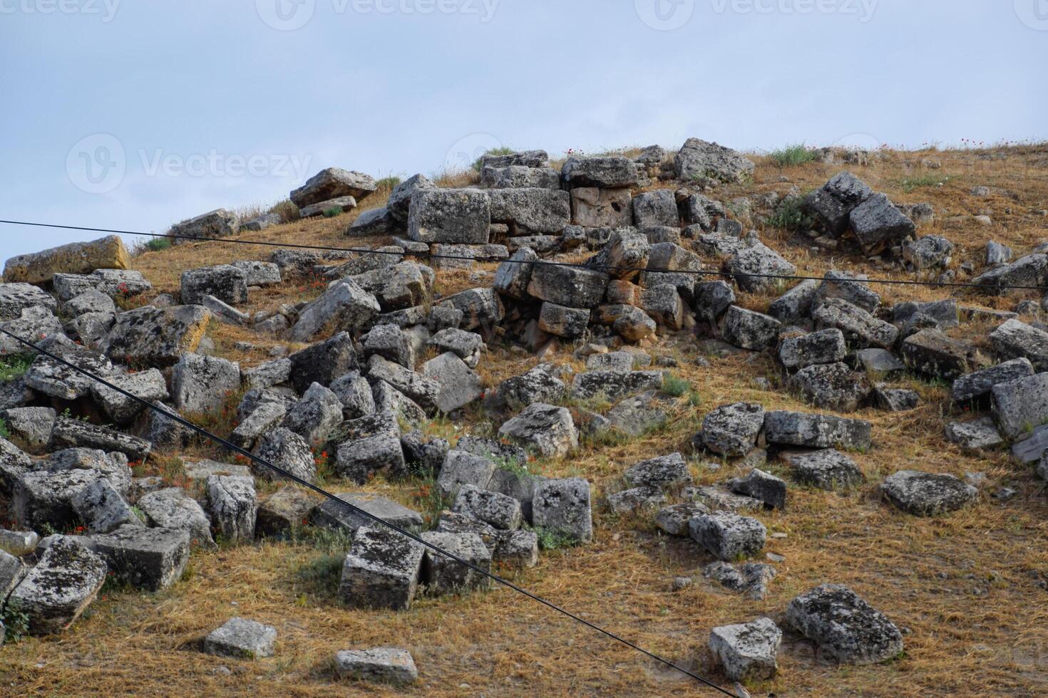 Huge blocks of a wall destroyed by an earthquake. Ruins of the city of Hierapolis photo
