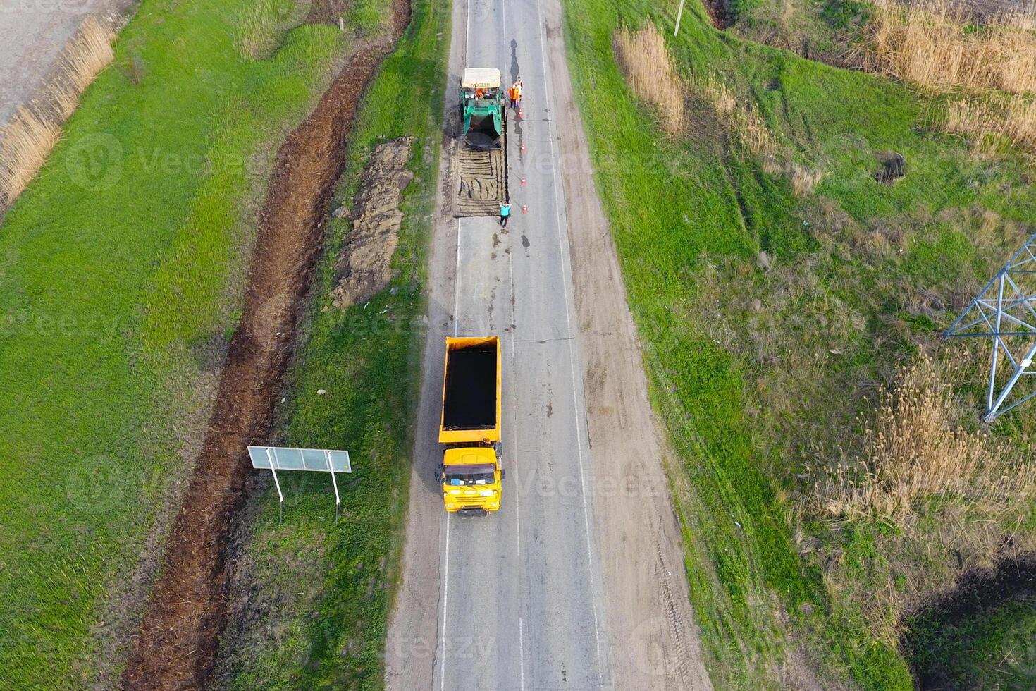 Top view of the road repair. Technics for repair of asphalt. Replacement of asphalt pavement. photo