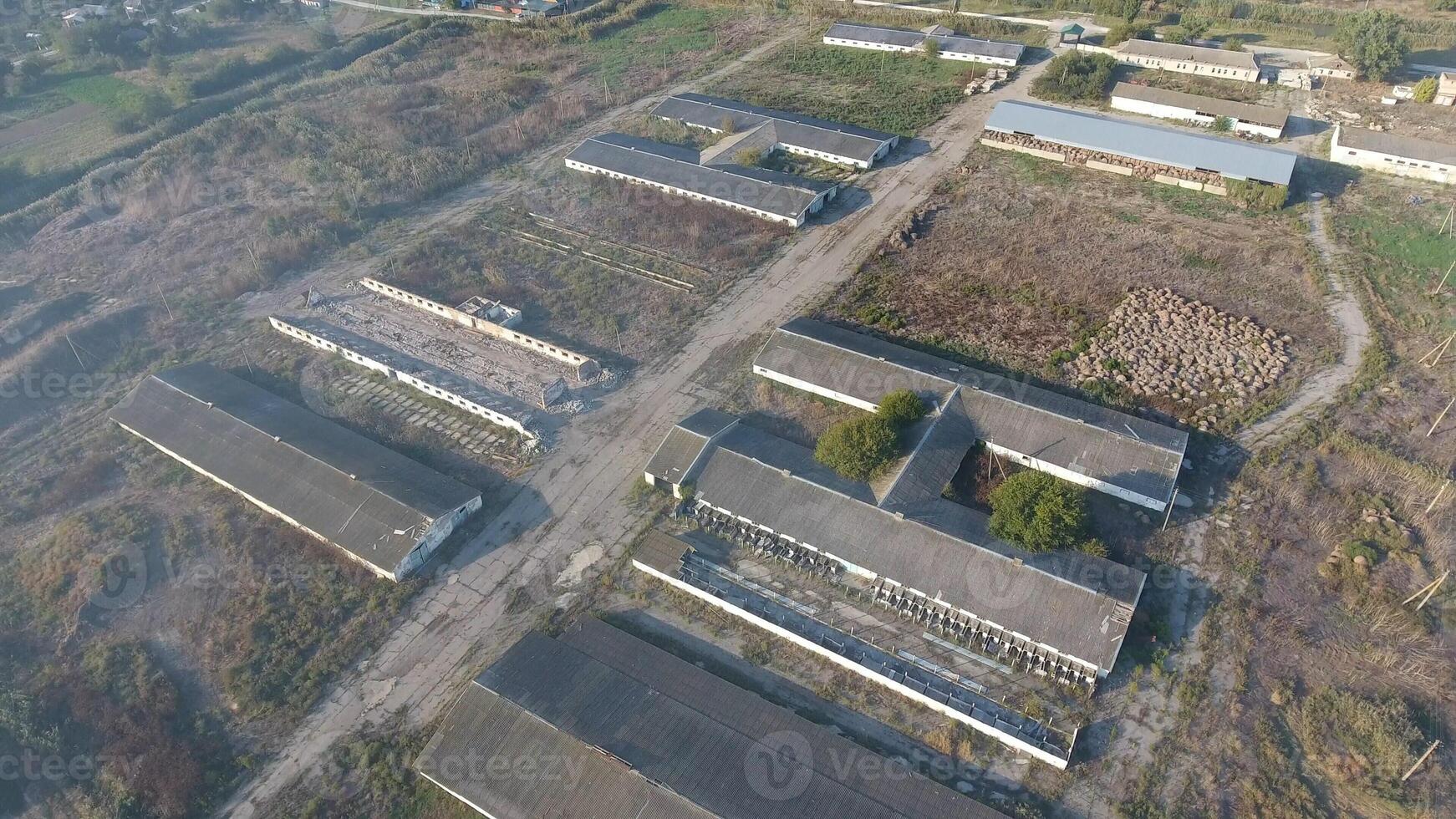 The building of an old farm for cattle. Top view of the farm. Storage of bales of hay on the old farm photo