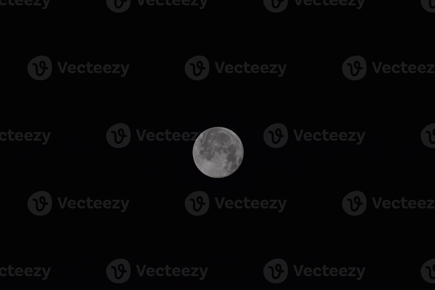 The moon in the night sky photo