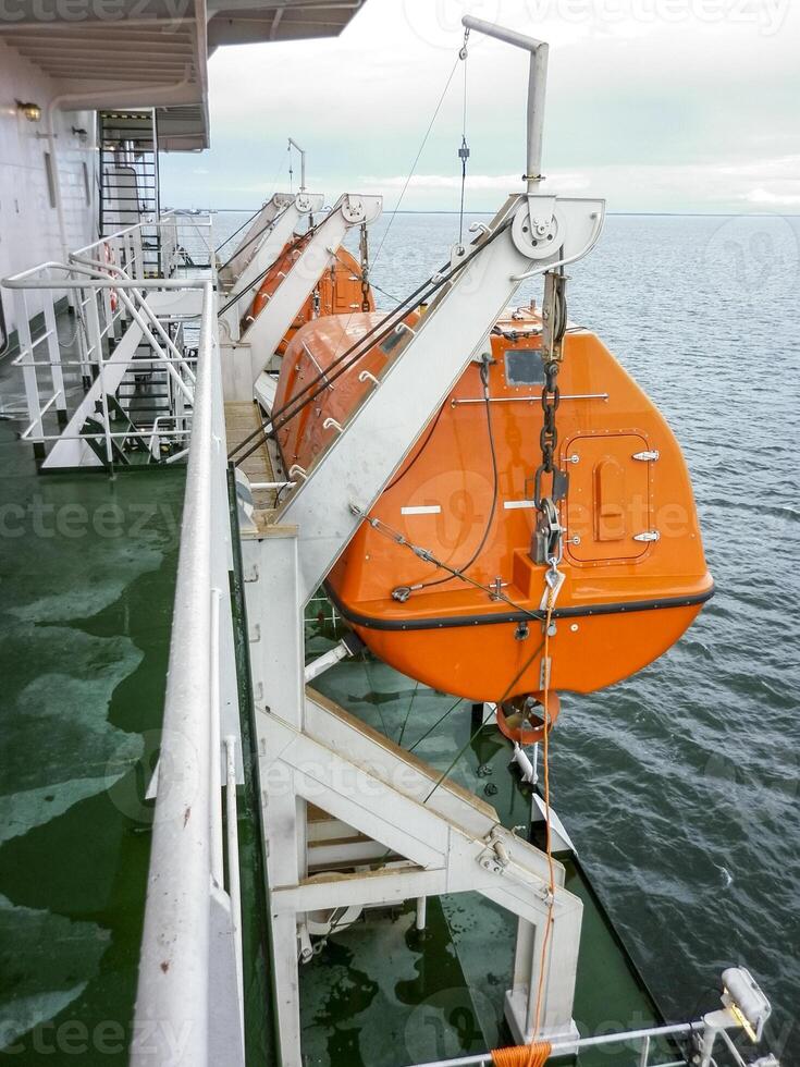 A lifeboat in case of an accident in the port or on a ship. The photo