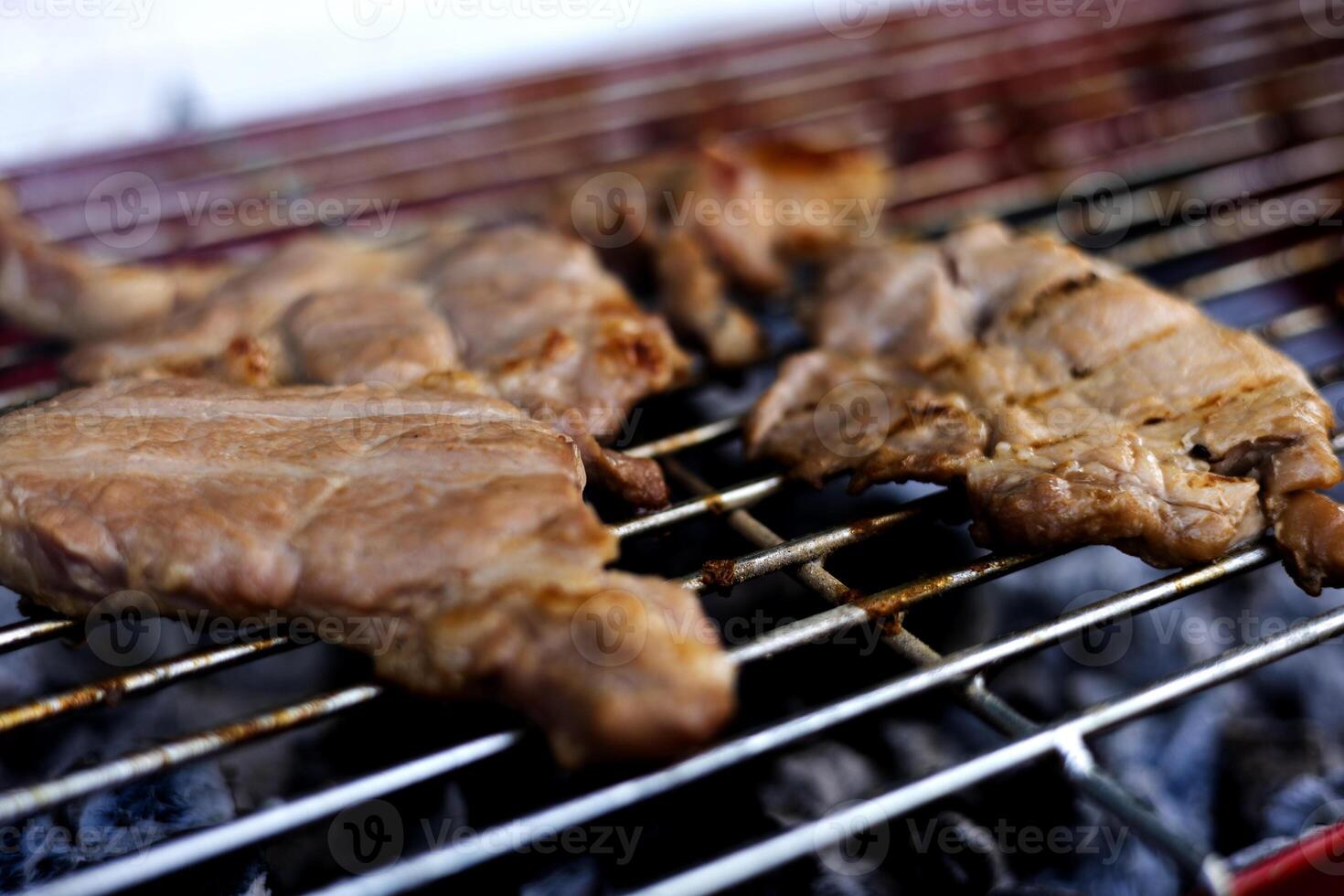 Barbecue Meat On Outdoor Grill. photo