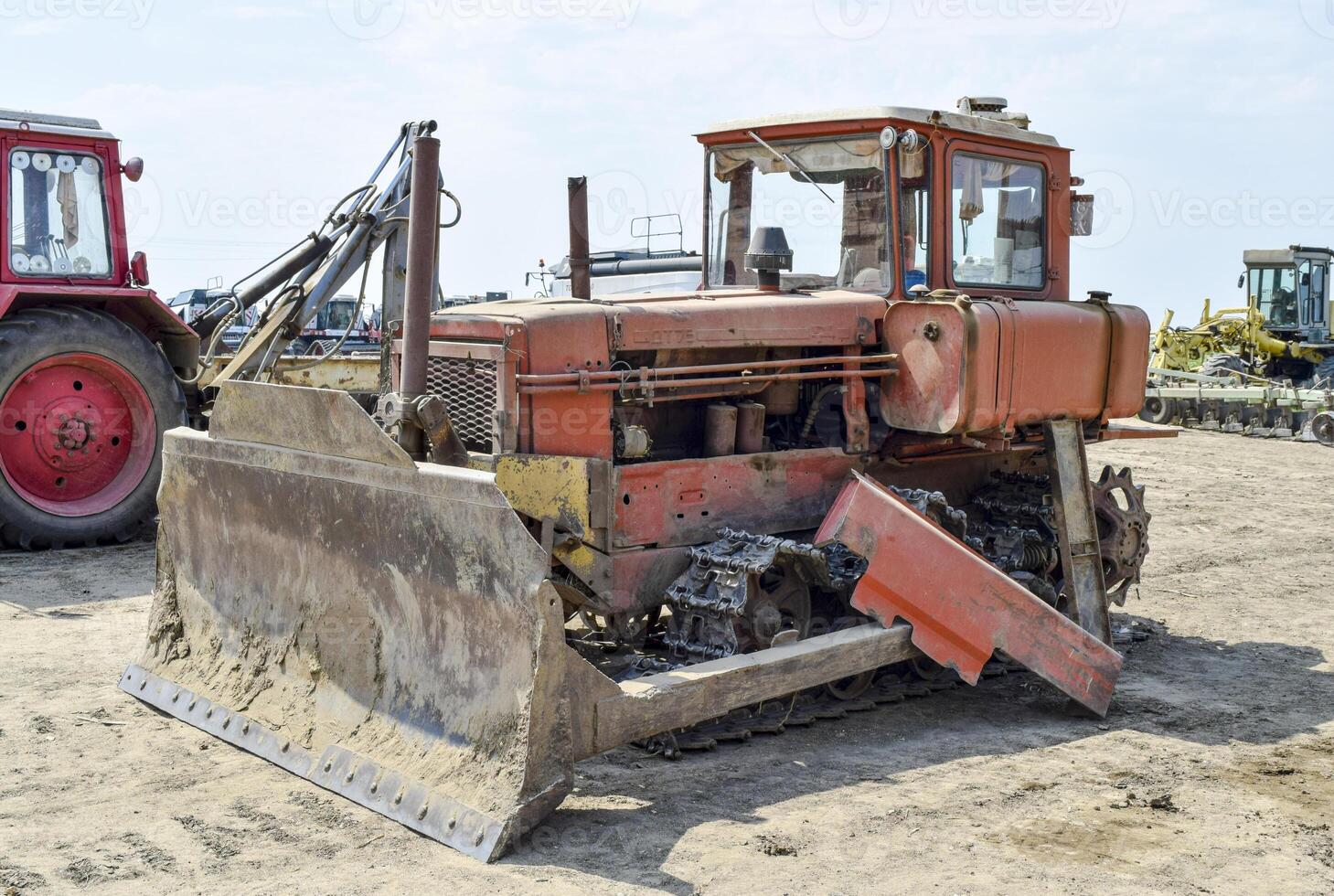 Tractor, standing in a row. Agricultural machinery. photo