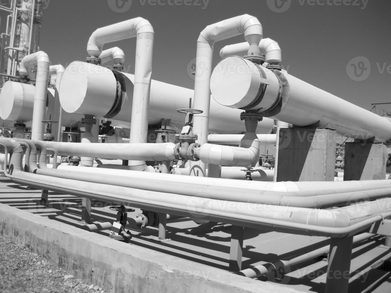 Heat exchangers in a refinery. The equipment for oil refining photo