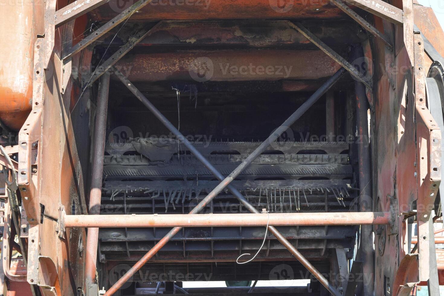 Old rusty disassembled combine harvester. photo