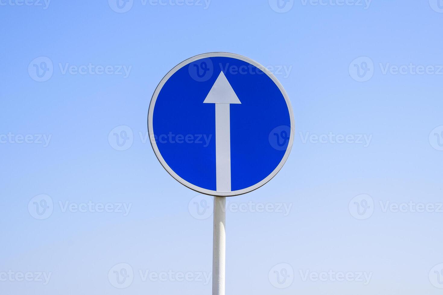 Traffic sign straight ahead. prescriptive sign. Sign on a blue sky background. photo