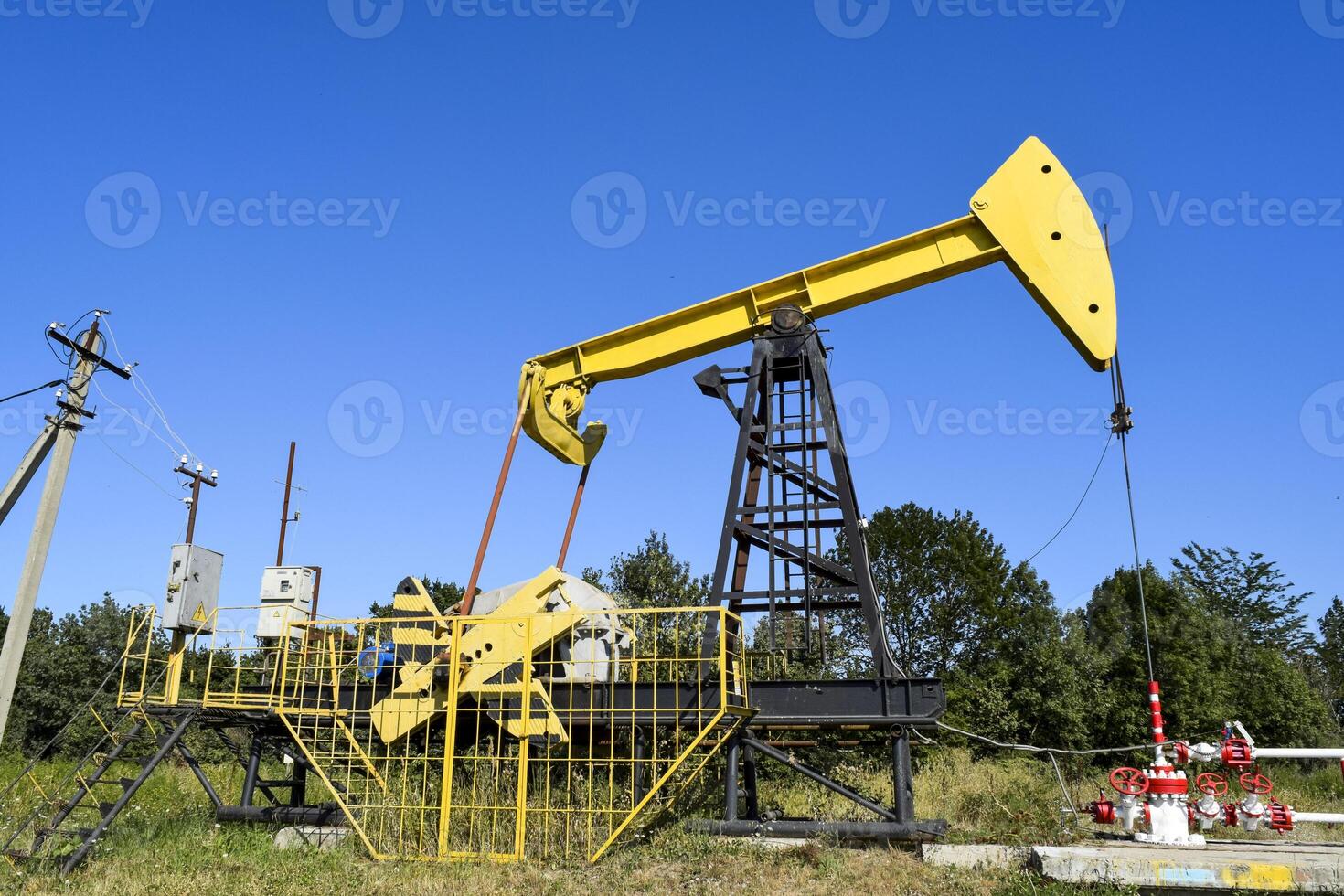 Pumping unit as the oil pump installed on a well photo