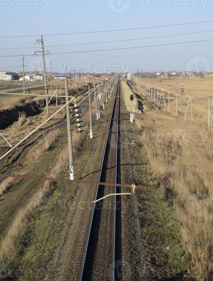 Plot railway. Top view on the rails. High-voltage power lines for electric trains photo