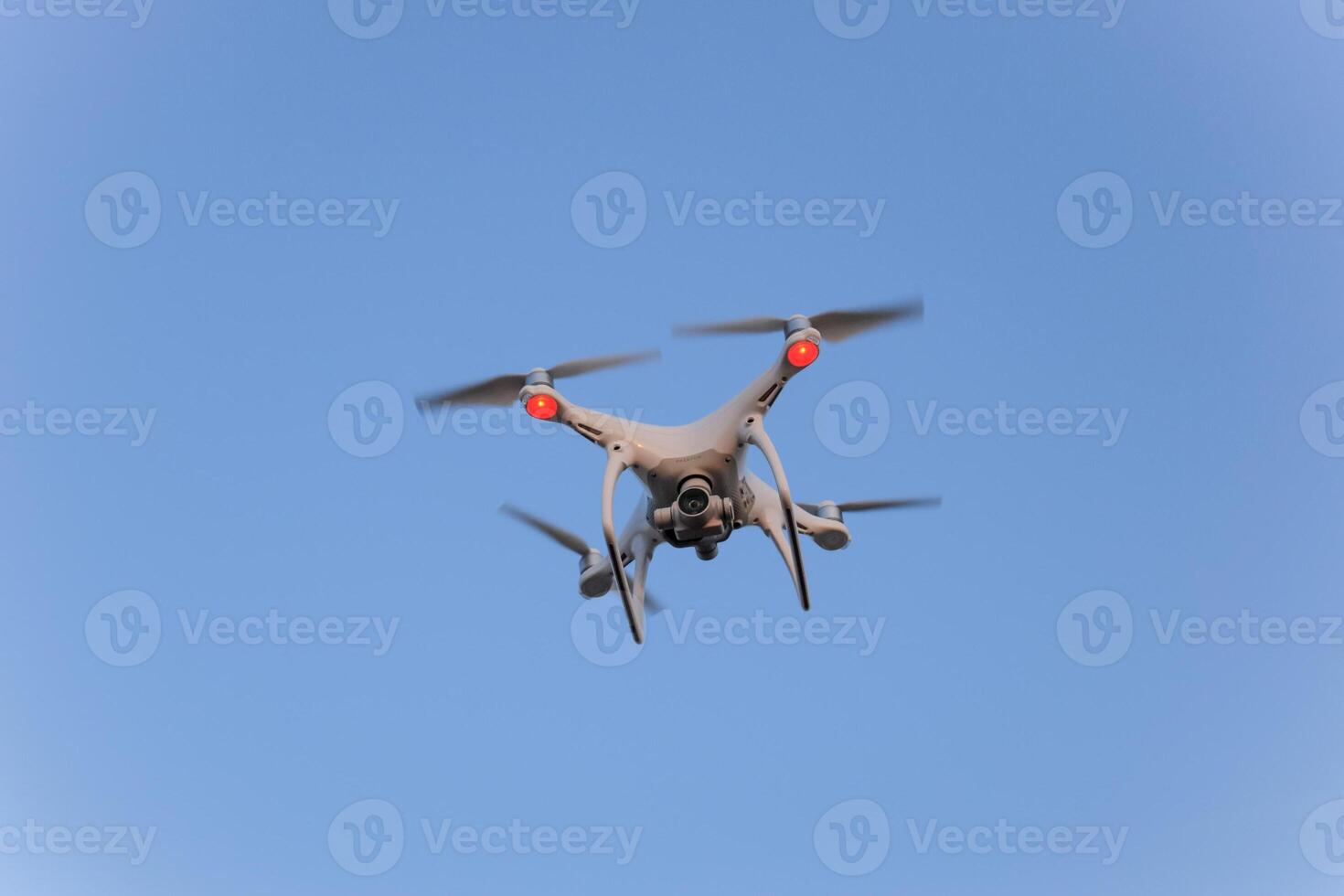 The drone, hovering in the sky. Flight quadrocopters photo