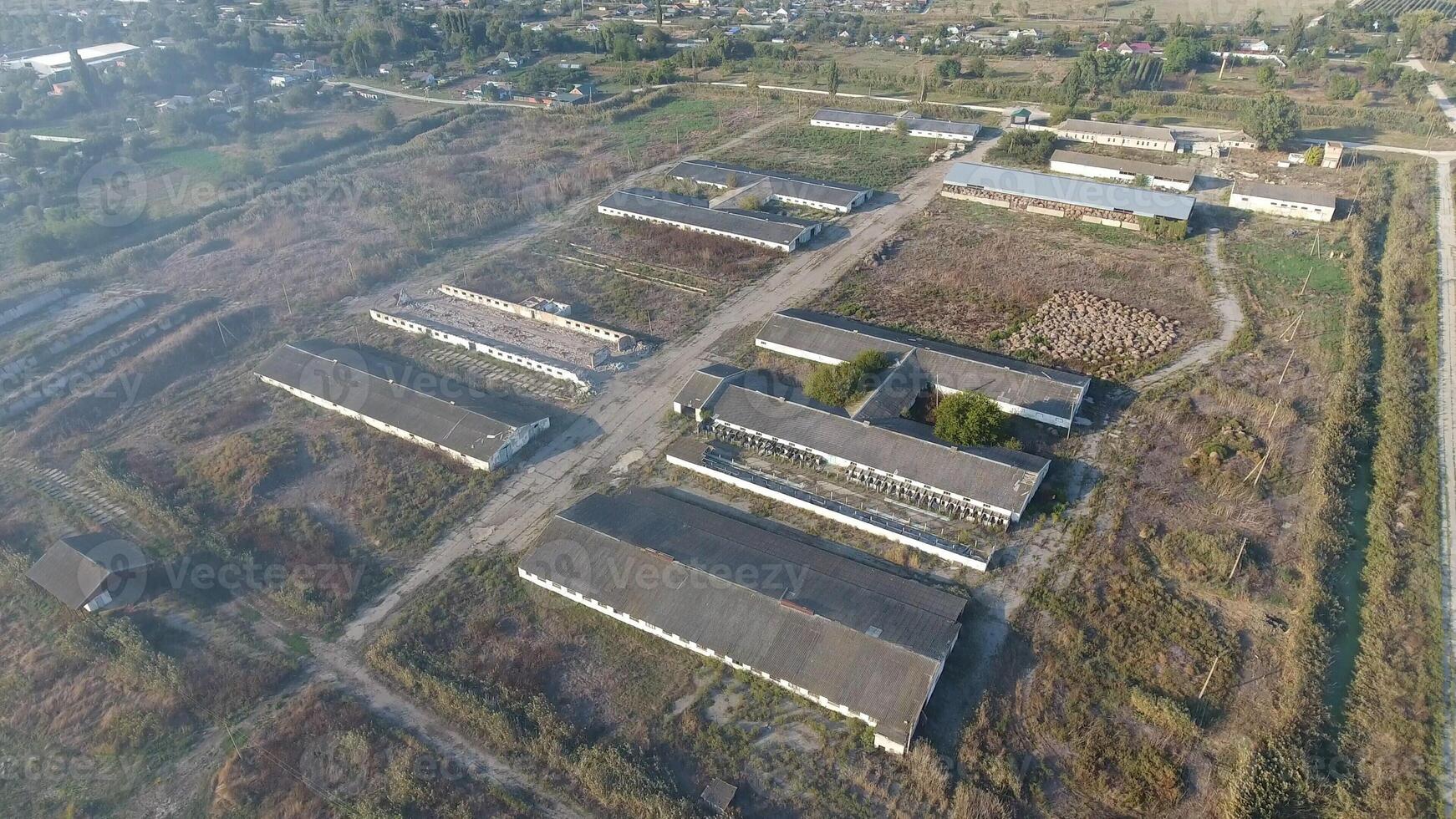The building of an old farm for cattle. Top view of the farm. Storage of bales of hay on the old farm photo