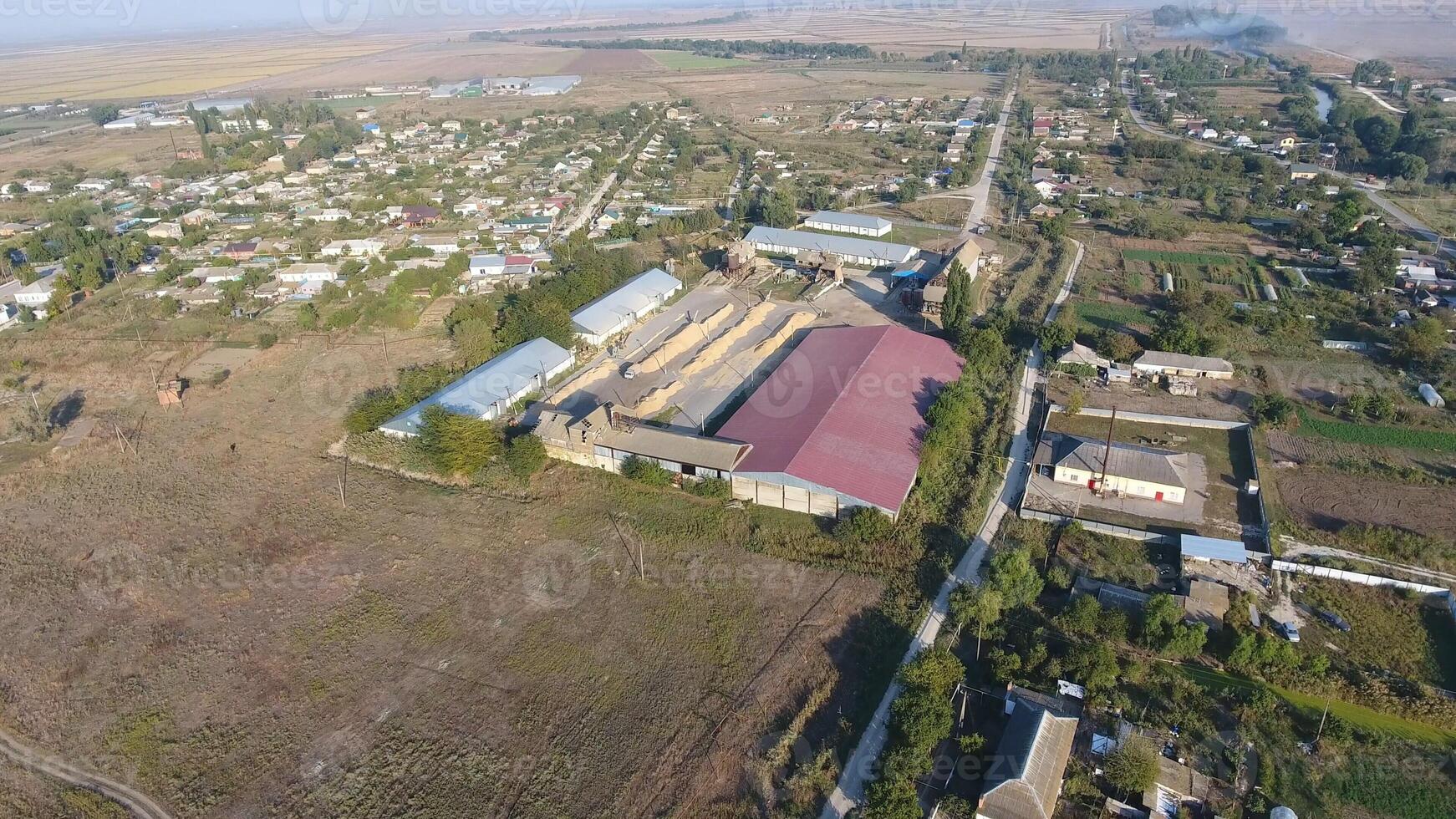 Hangar for storage of grain. A platform for drying and sintering grain. Harvested grain photo