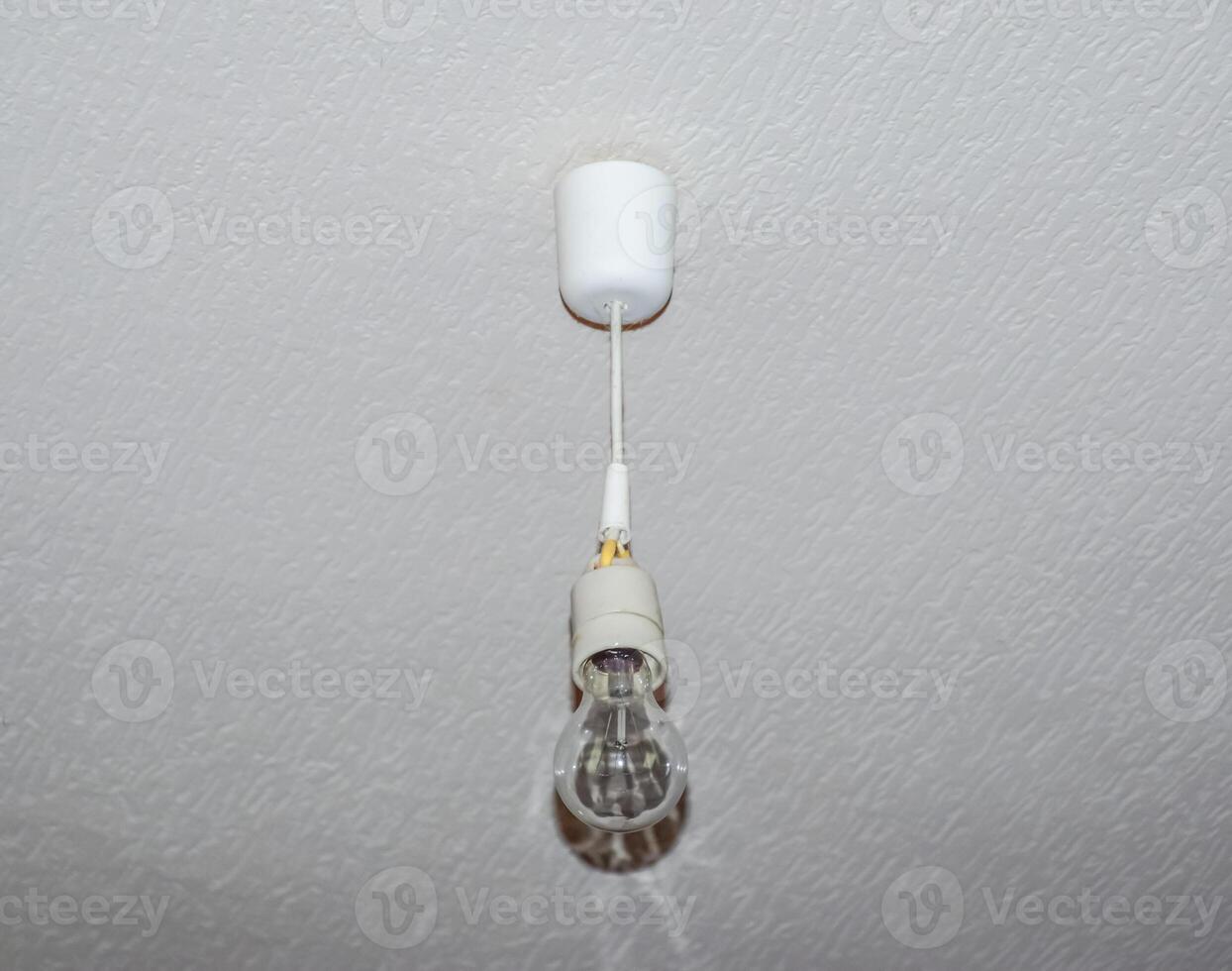 Simple white bowl with an incandescent lamp photo