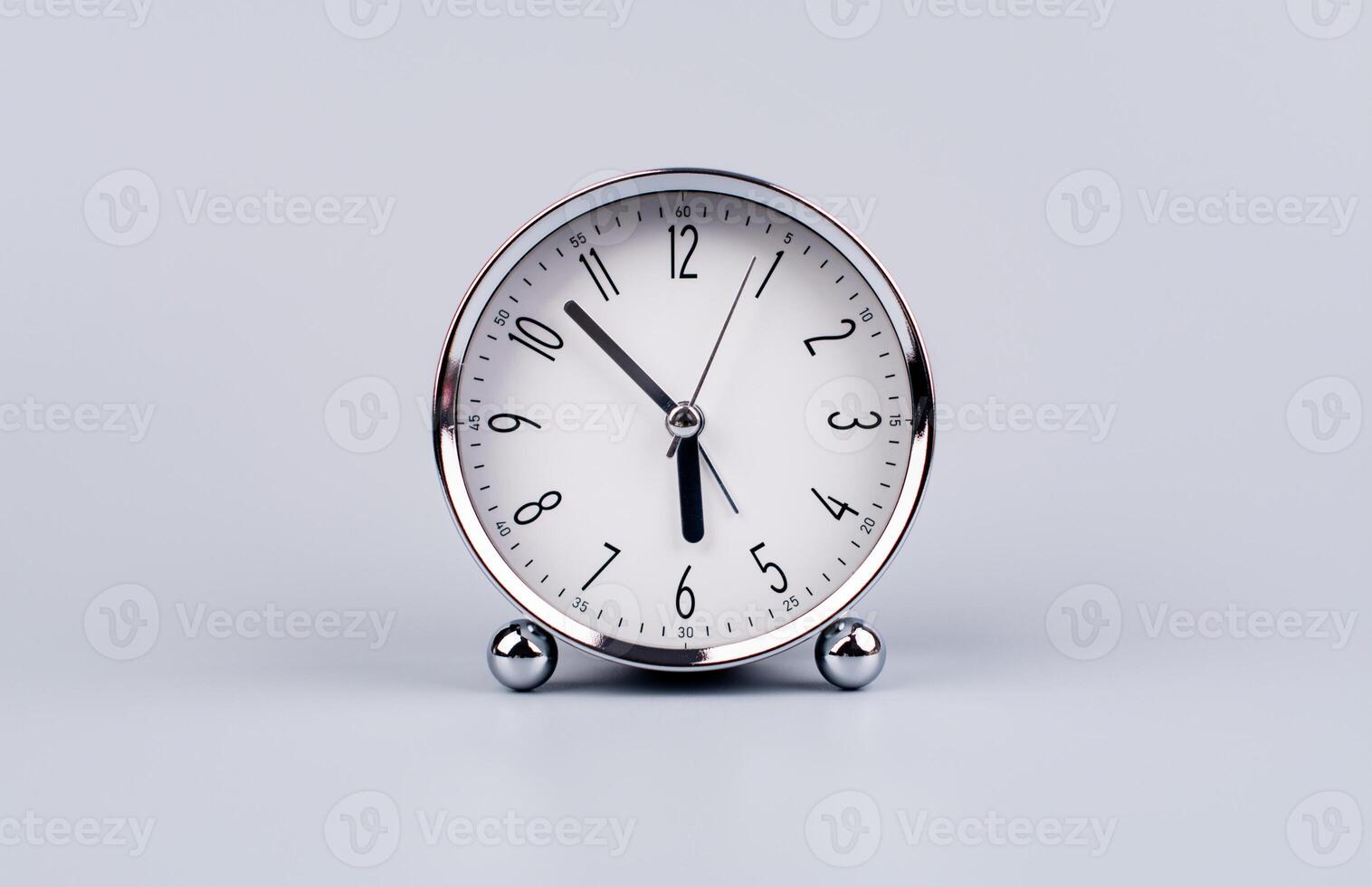 Time and work in daily life Photo of a modern clock in a high quality photo studio.