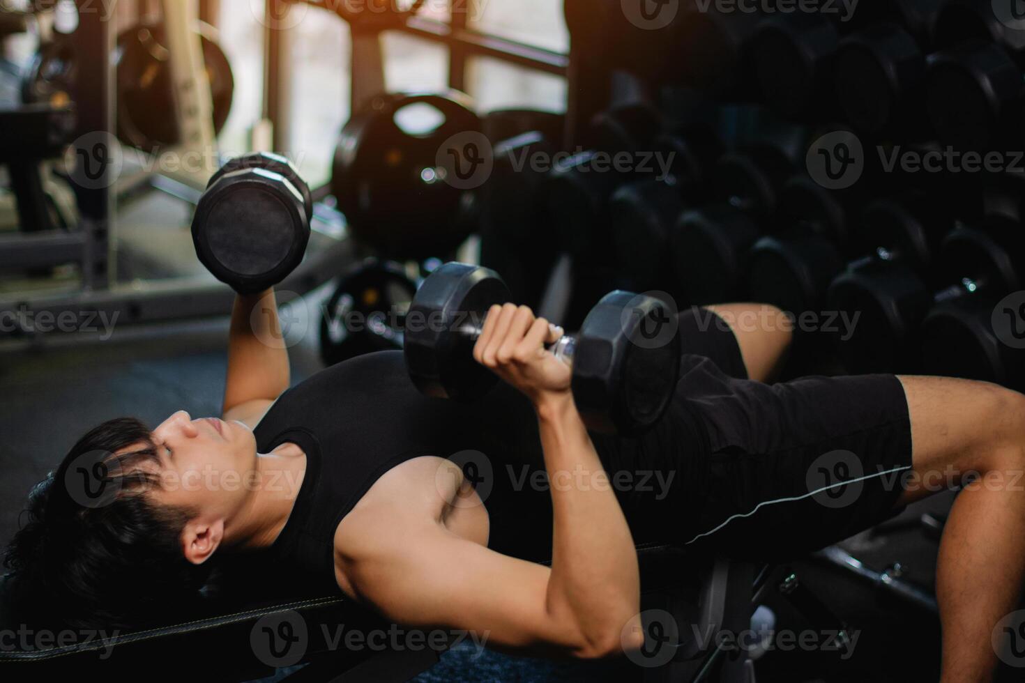 Exercise with dumbbells Lift weights to build strong arm muscles, an activity for good physical health. photo