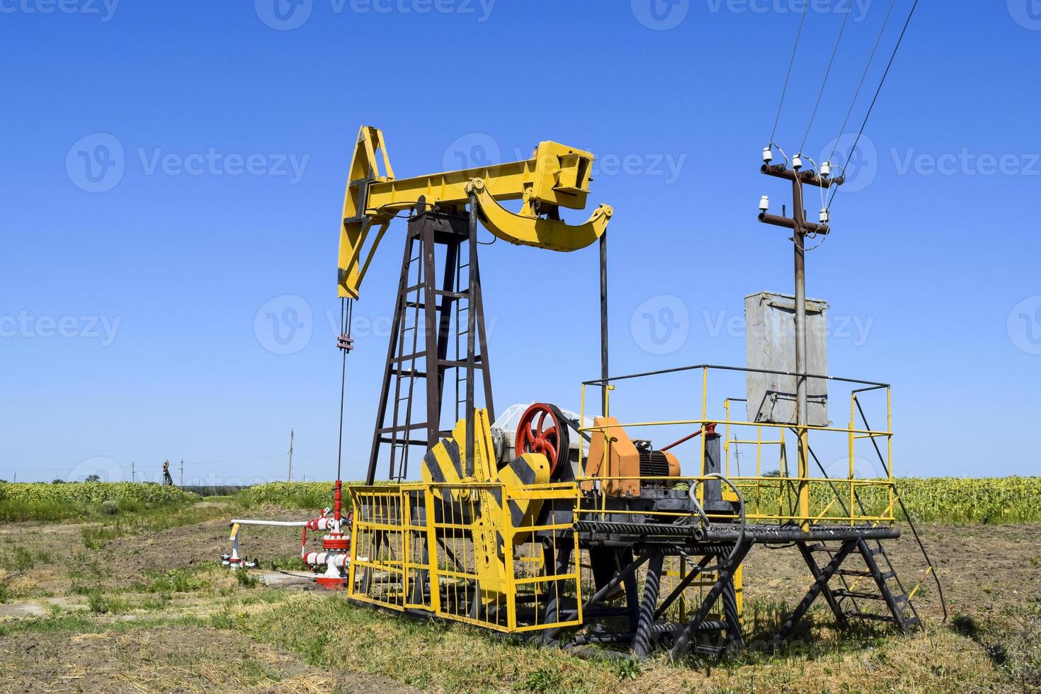 Pumping unit as the oil pump installed on a well photo