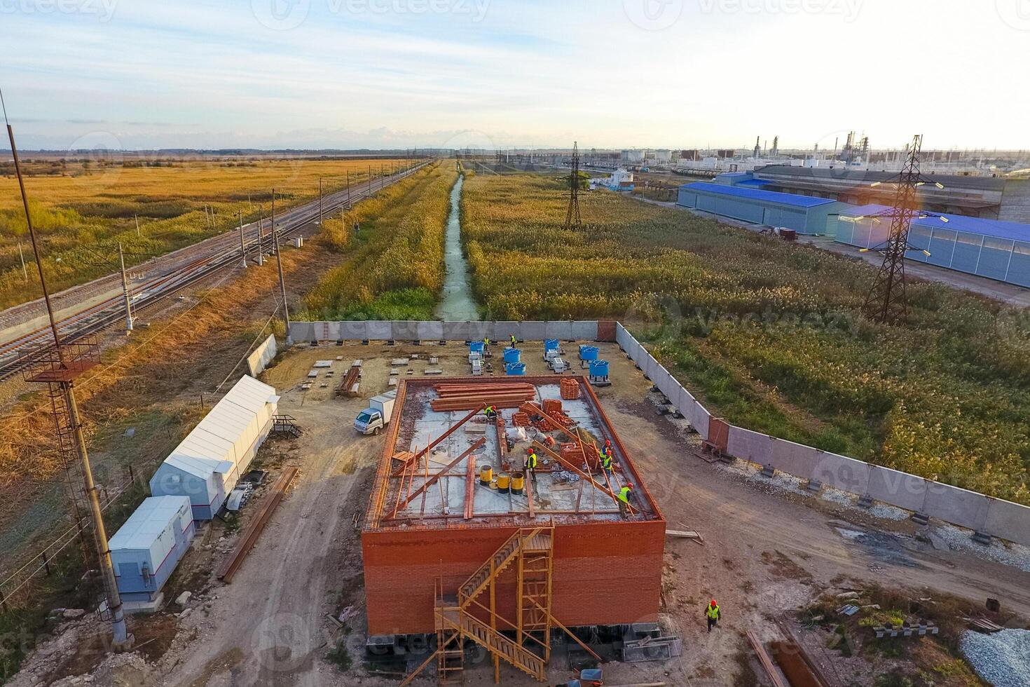 Construction of a brick building. Installation of the roof. Construction works. photo