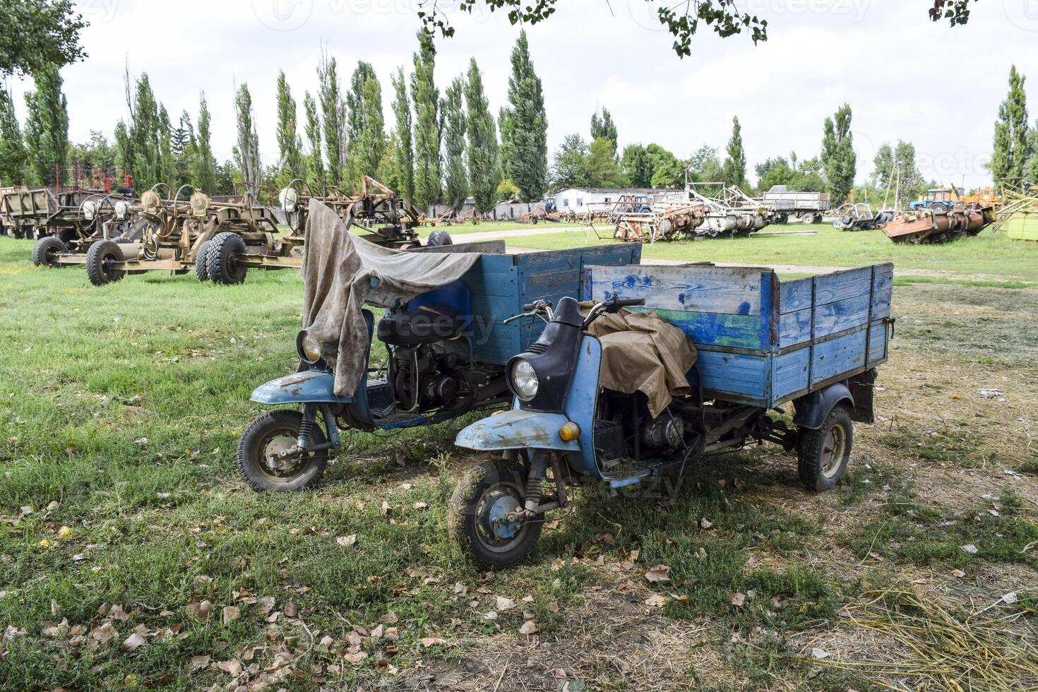 Scooter ant. Old Soviet motor scooter on three wheels with a cart photo
