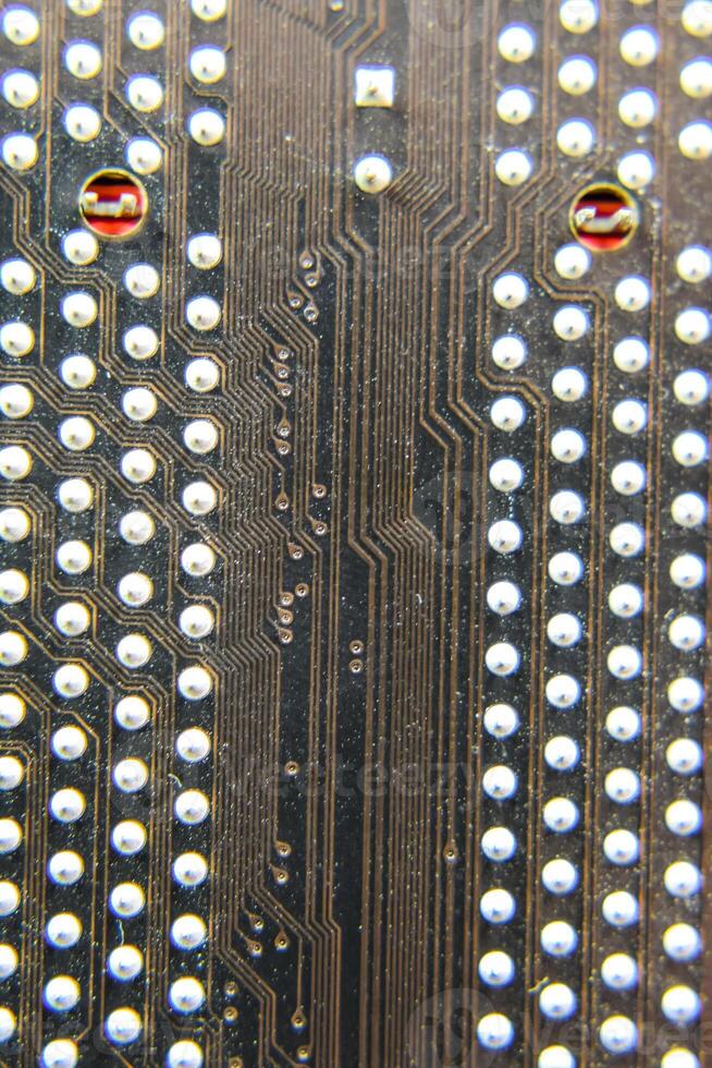 The reverse side of the microboard. Contacts solder. Soldered parts. Electronic board with electrical components. Electronics of computer equipment photo