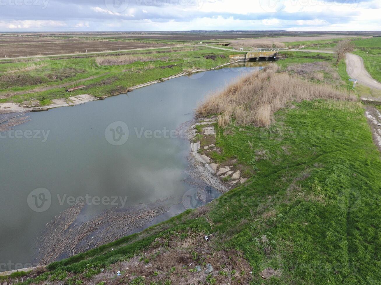 Bridges through irrigation canals. Rice field irrigation system photo