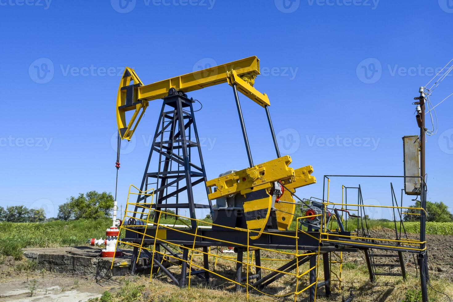 Pumping unit as the oil pump installed on a well photo