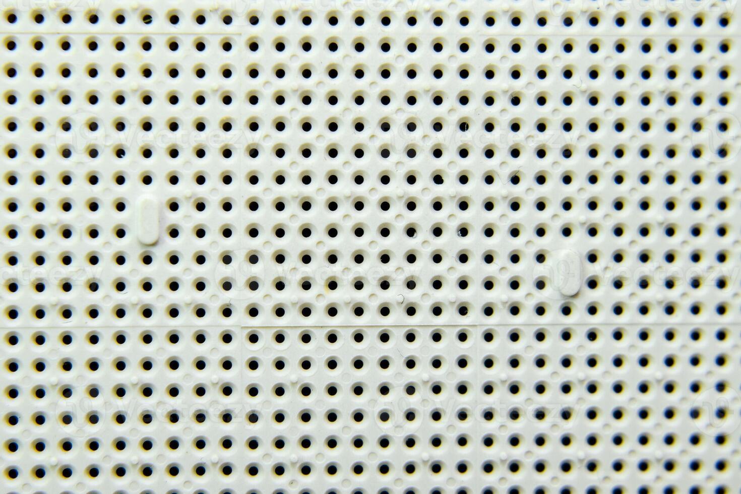 A socket under the processor of the computer, holes under the feet of the contacts. Electronic board with electrical components. Electronics of computer equipment photo