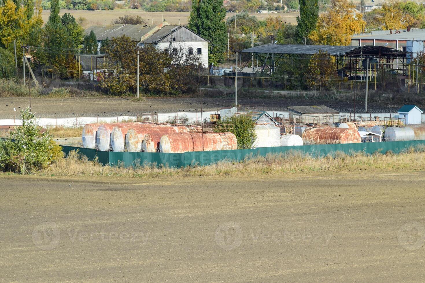 View of an old base of combustible lubricants. Barrels for storing gasoline. An old settlement. photo