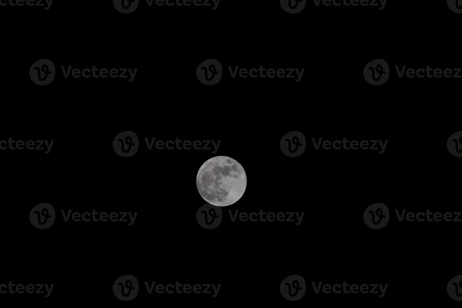 The moon in the night sky photo