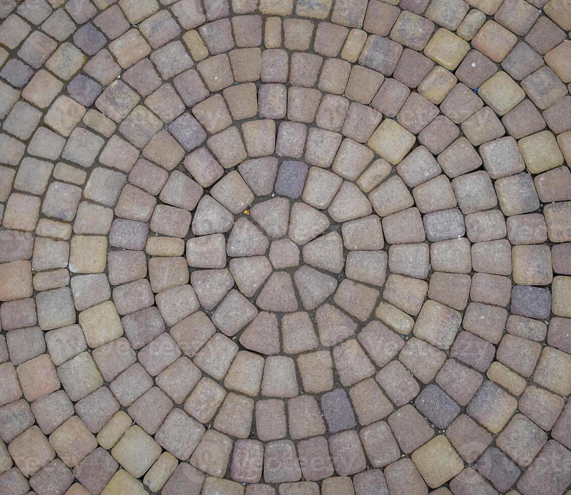 Background texture of paving slabs in circles photo