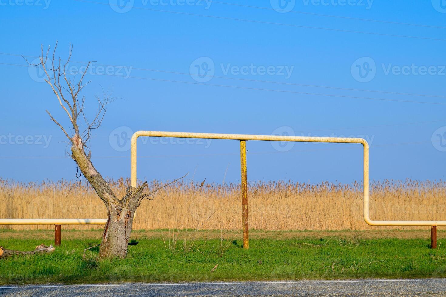 The arch of the gas pipeline above the passage in field. photo