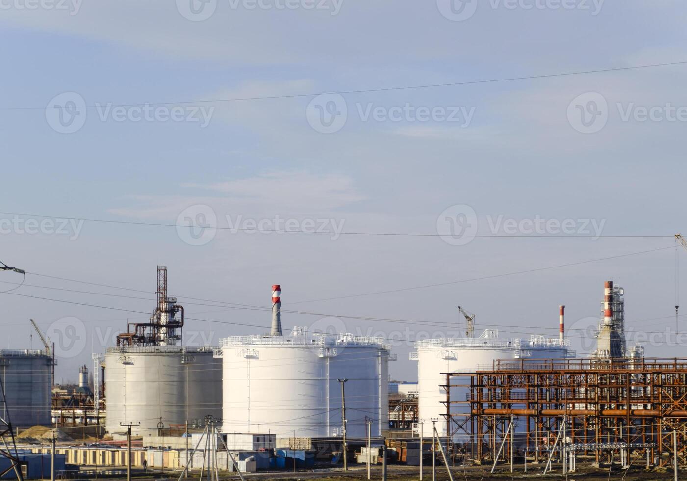 Distillation columns, pipes and other equipment furnaces refinery. photo
