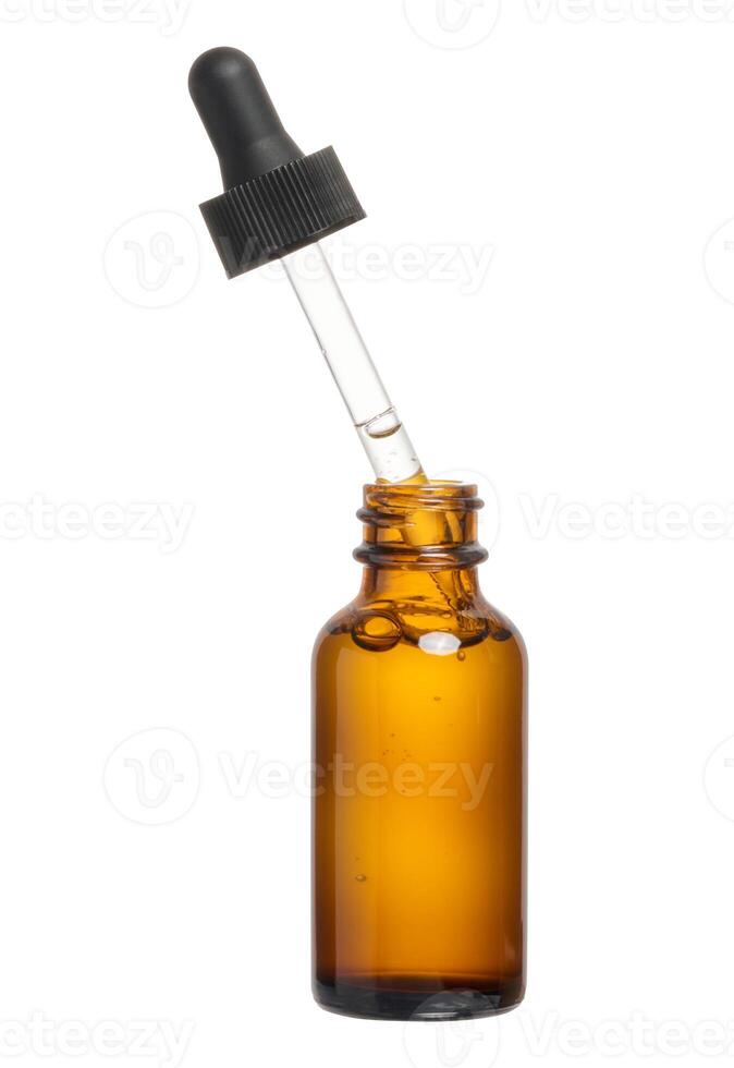 A glass brown bottle with a dropper on a white isolated background photo