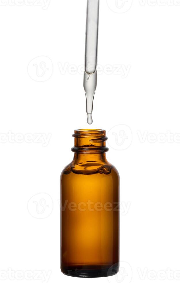 A glass brown bottle with a dropper on a white isolated background, a container for cosmetic products. photo