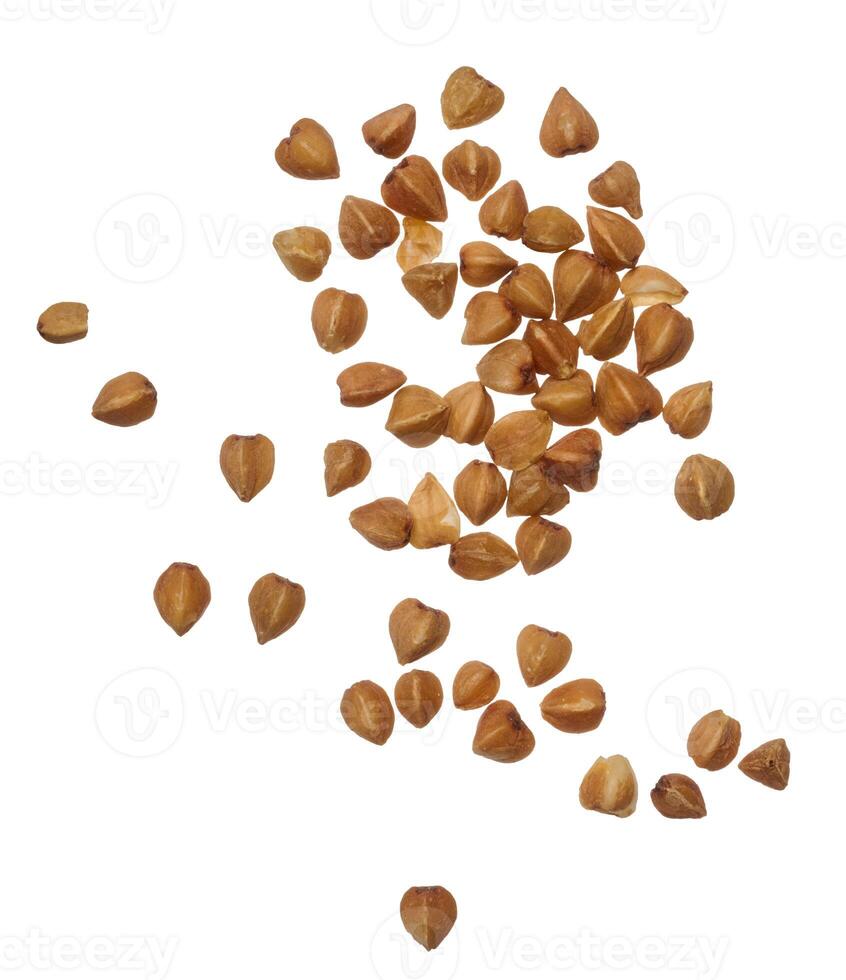 Raw buckwheat grains on isolated background photo