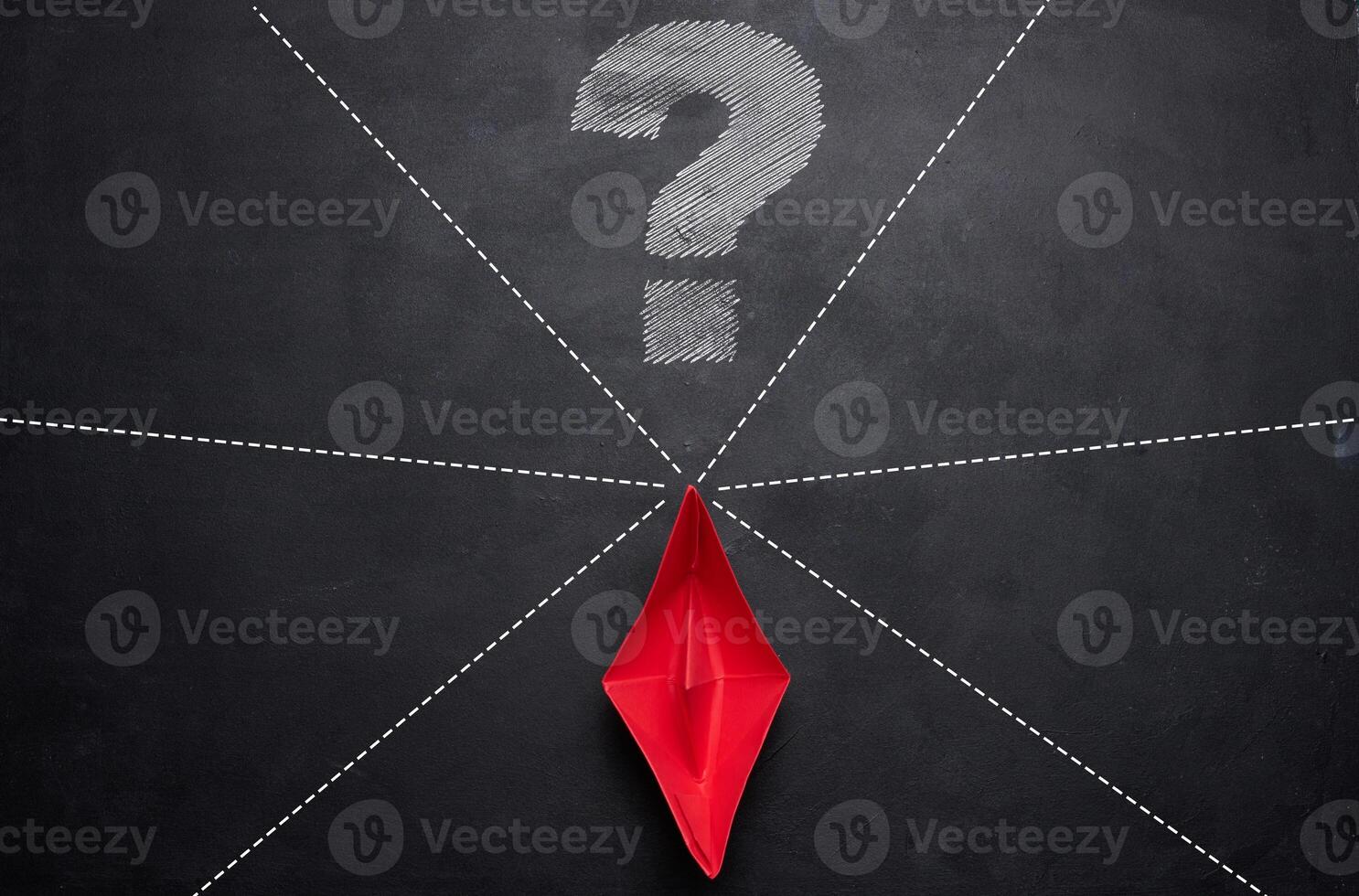 Red paper boat and various directions for movement, with a drawn question mark photo