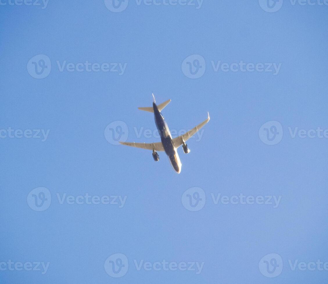 Passenger aircraft in the sky at low altitude flies to the airport to land. photo