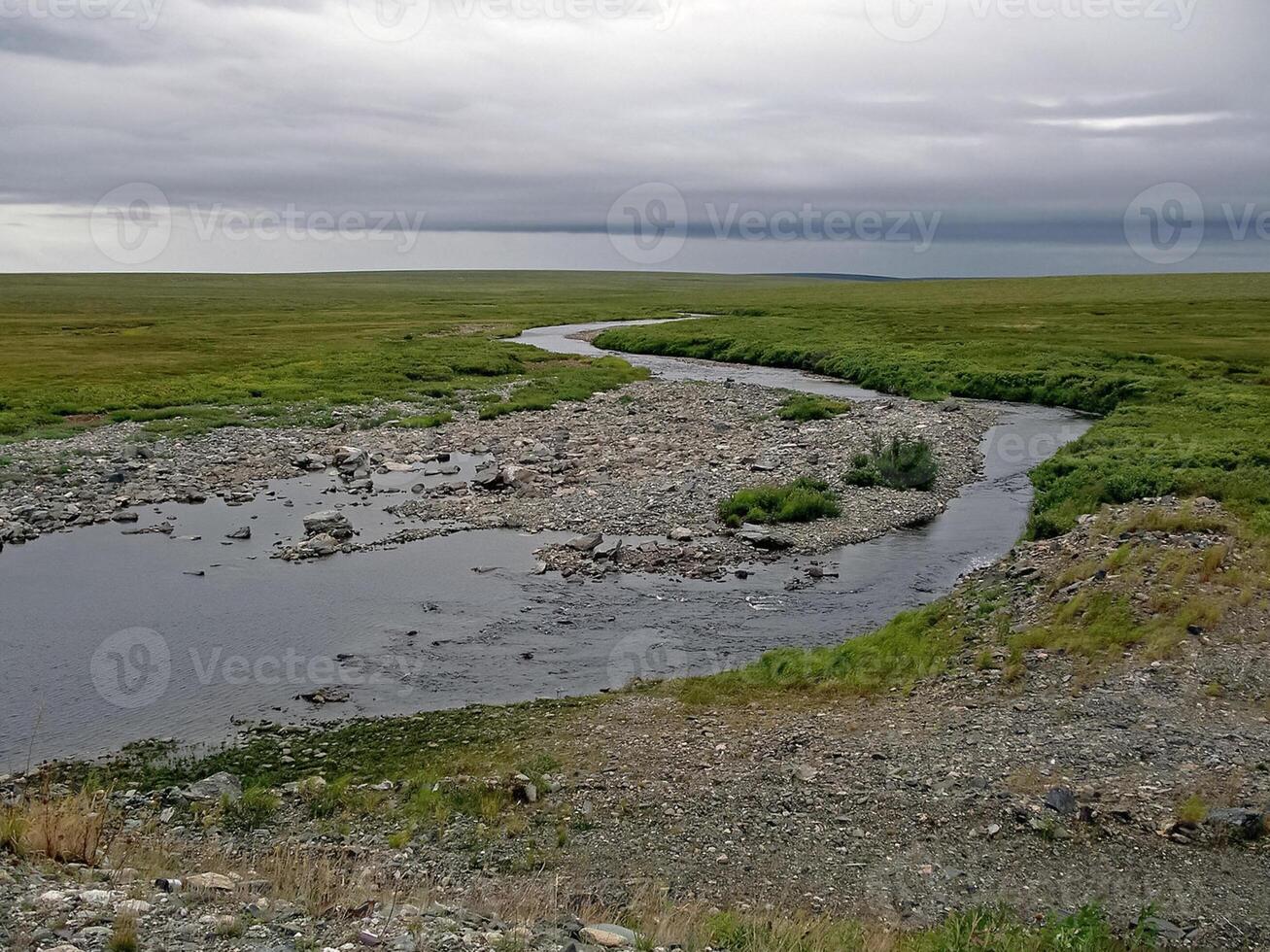 Streams of water in a small river. The flow of water. photo