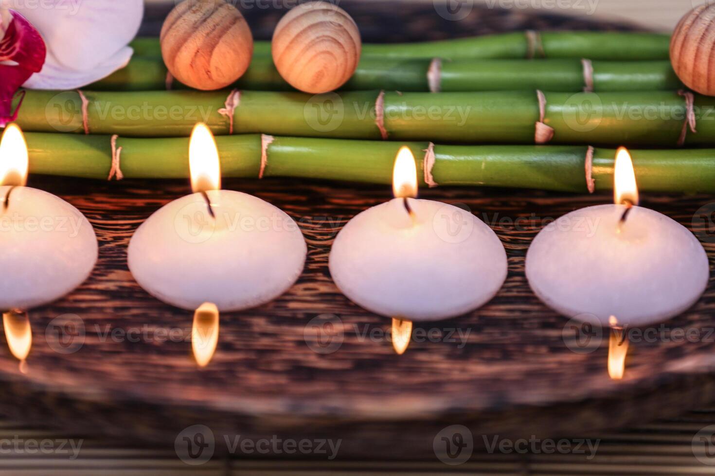 Spa composition with candles on water photo