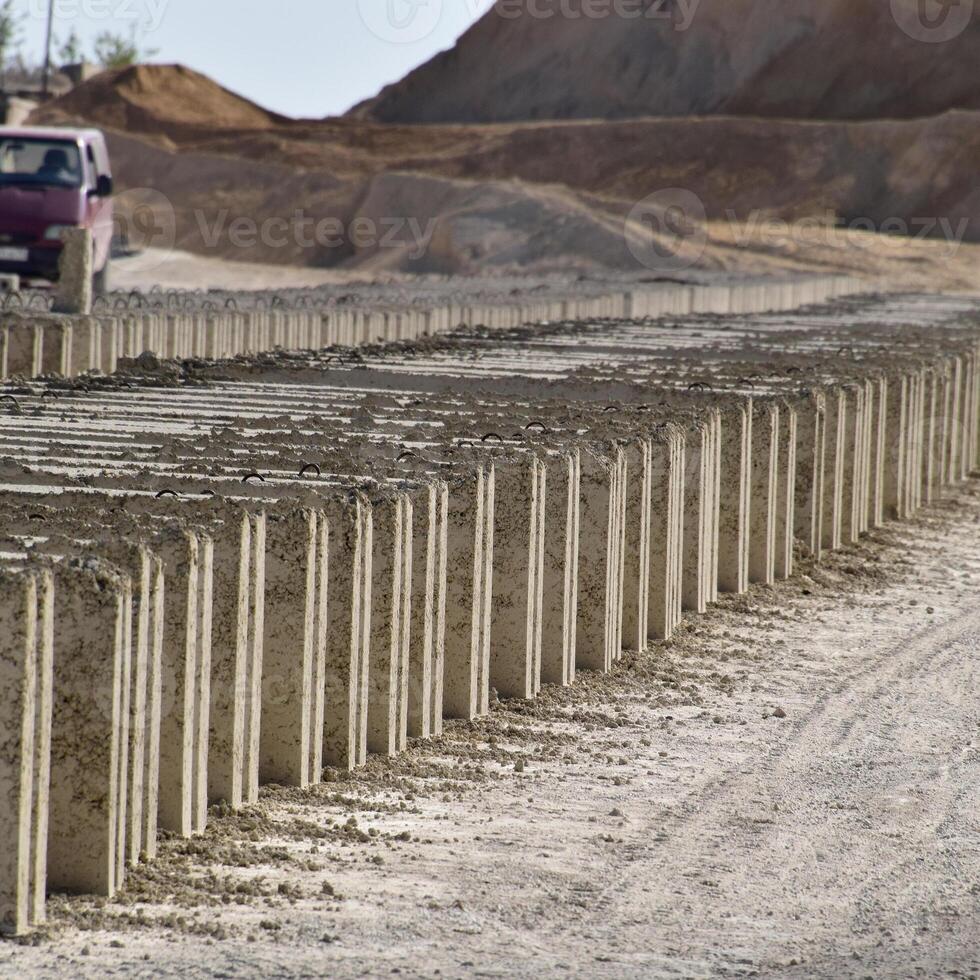 Cinder blocks lie on the ground and dried. on cinder block production plant. photo