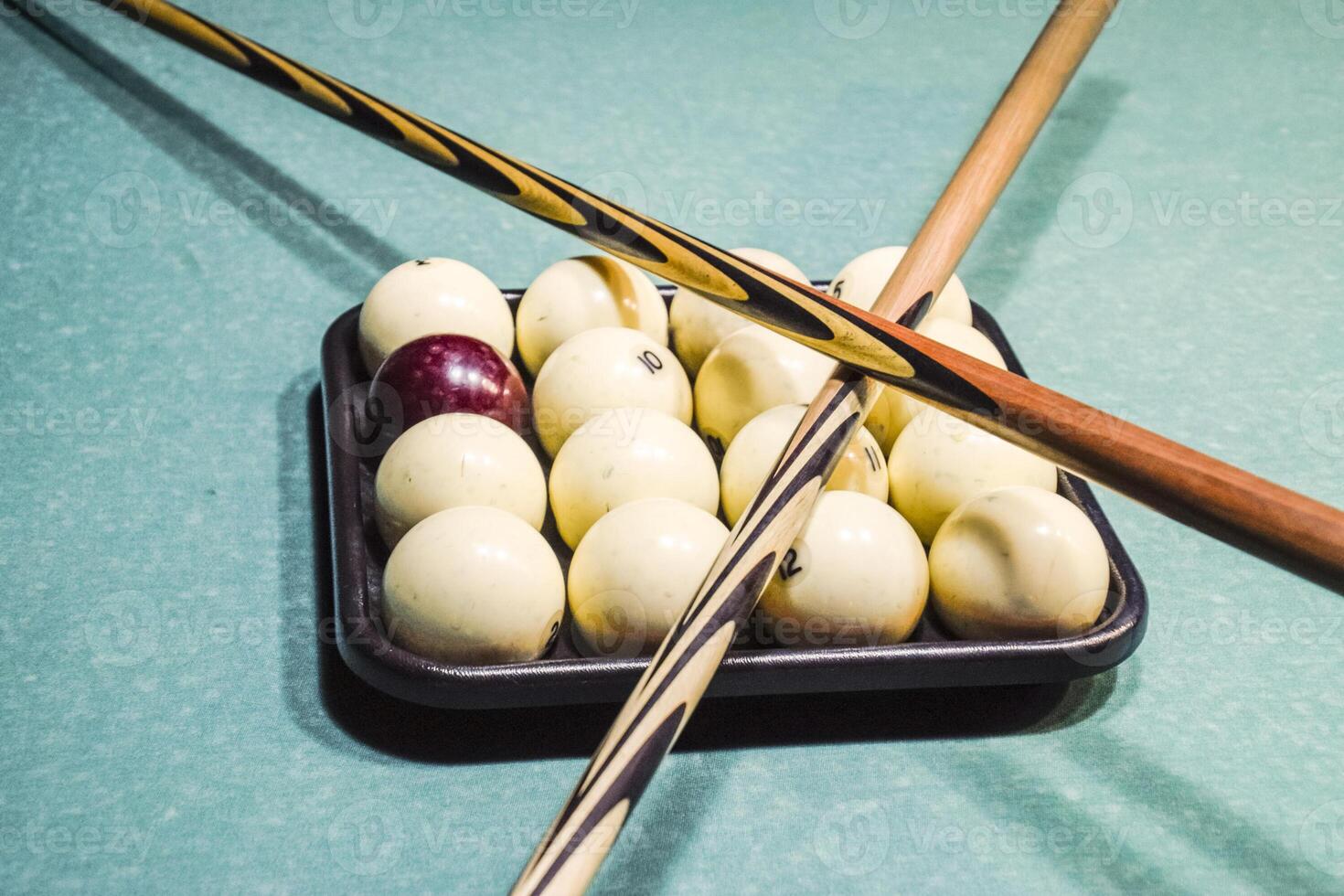 Billiards, billiard table, balls and cue. Balls in the tray and photo